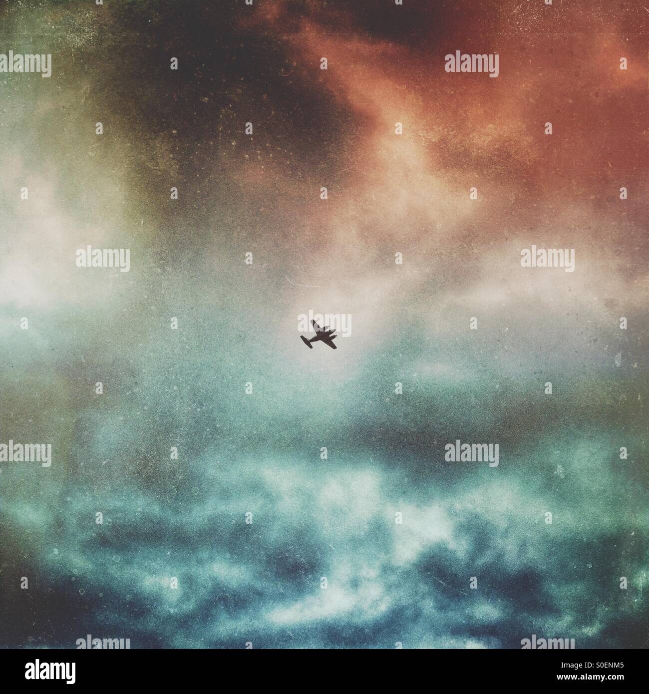 WWII spitfire flying in gloomy sky - Smartphone Captured Stock Image WWII spitfire flying in gloomy sky - Smartphone Captured Stock Image