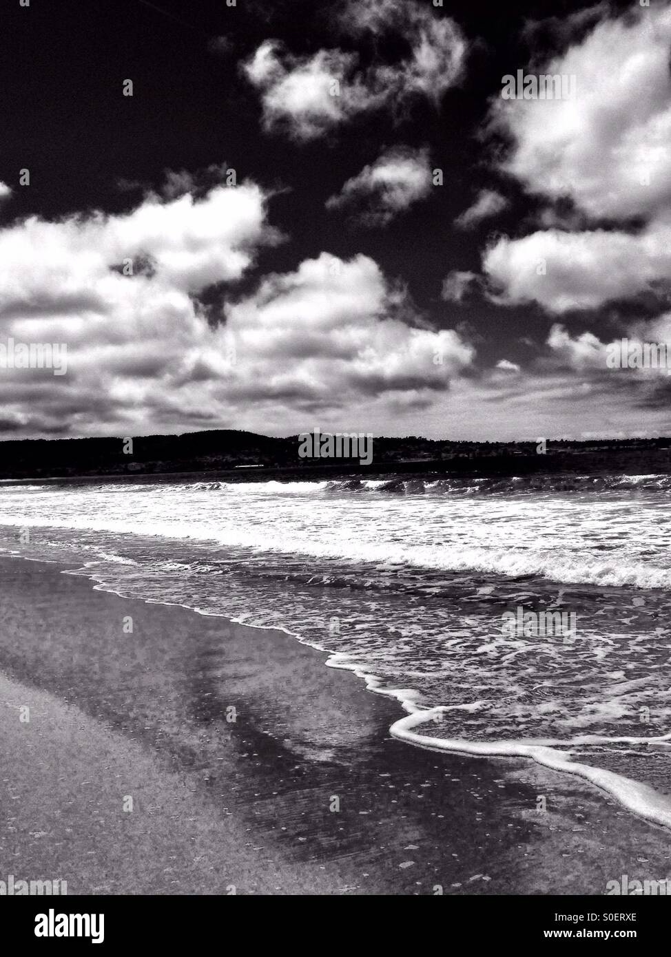 Pacific Ocean beach scene with clouds ,in black and white - Smartphone Captured Stock Image