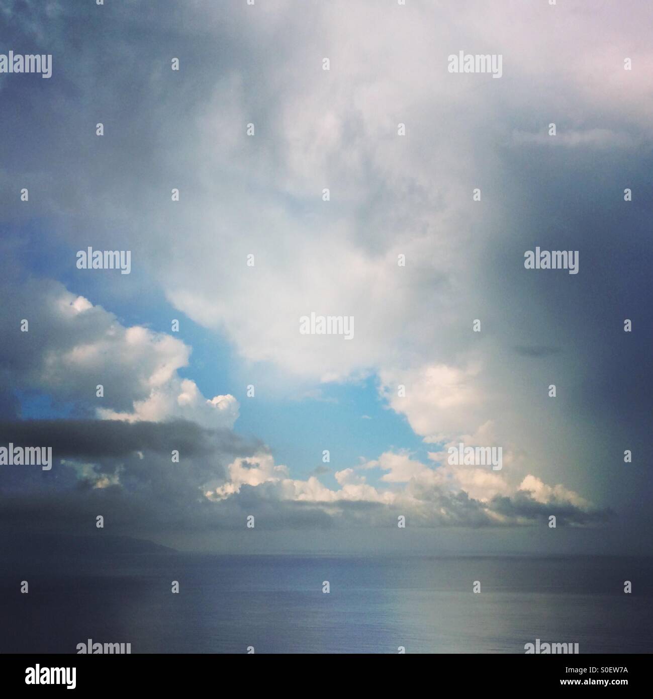 A break in dramatic storm clouds over the Ionian Sea and Zakynthos. - Smartphone Captured Stock Image