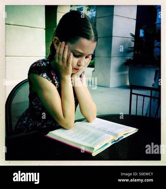 Girl reading book - Smartphone Captured Stock Image