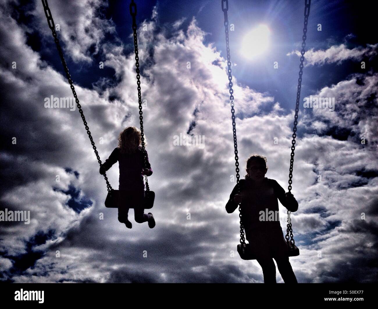 Children On Swings High Resolution Stock Photography and Images - Alamy