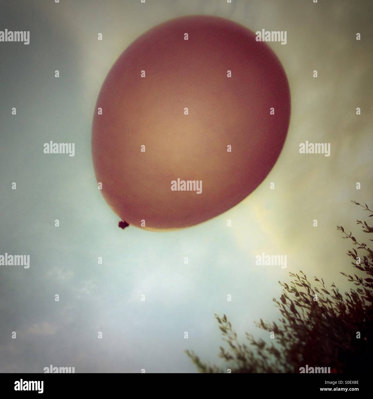 Balloon flying on blue sky in Barcelona, Catalonia, Spain. Freedom - Smartphone Captured Stock Image