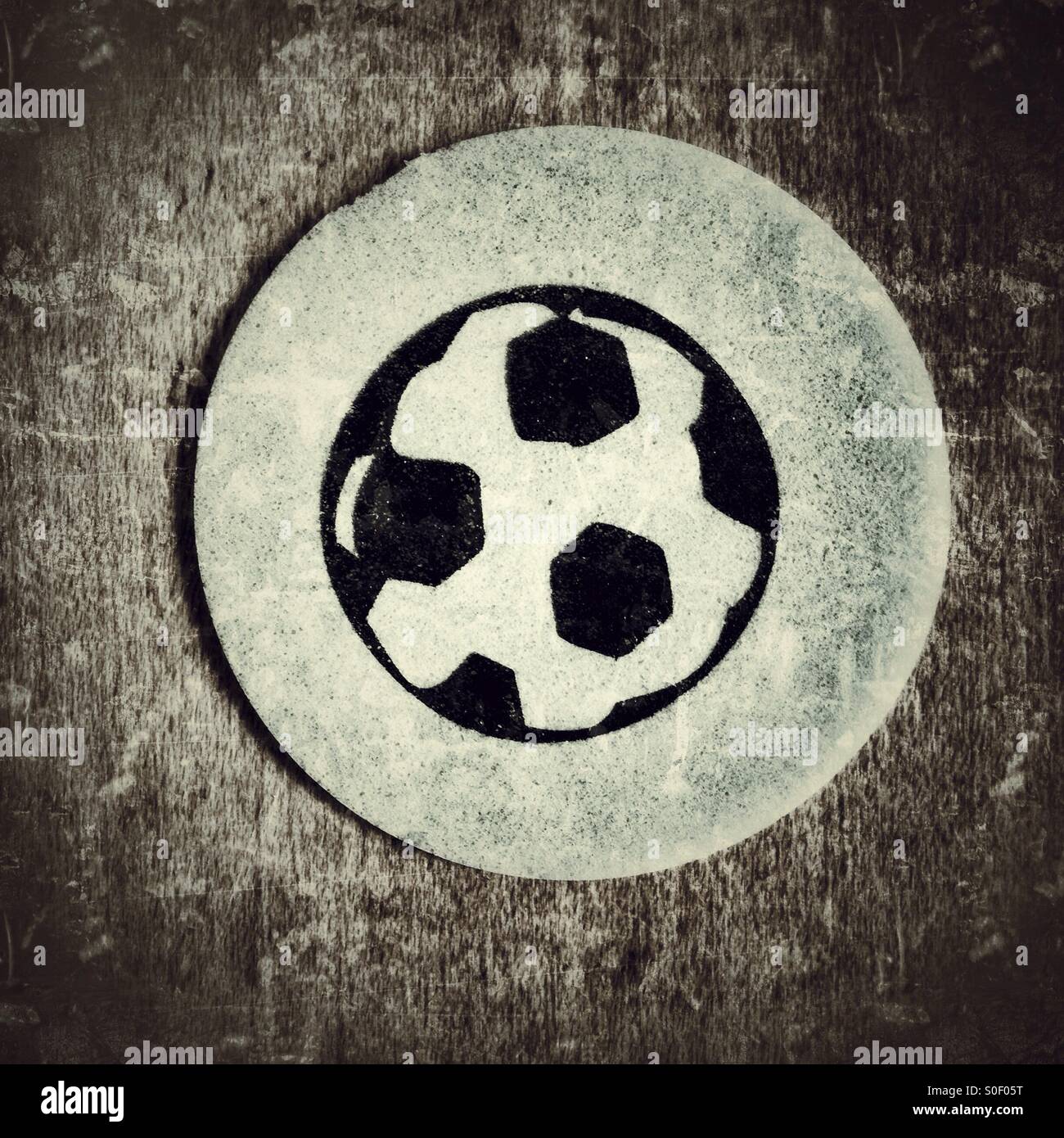 A tongue tattoo of a football printed on edible paper for children - Smartphone Captured Stock Image