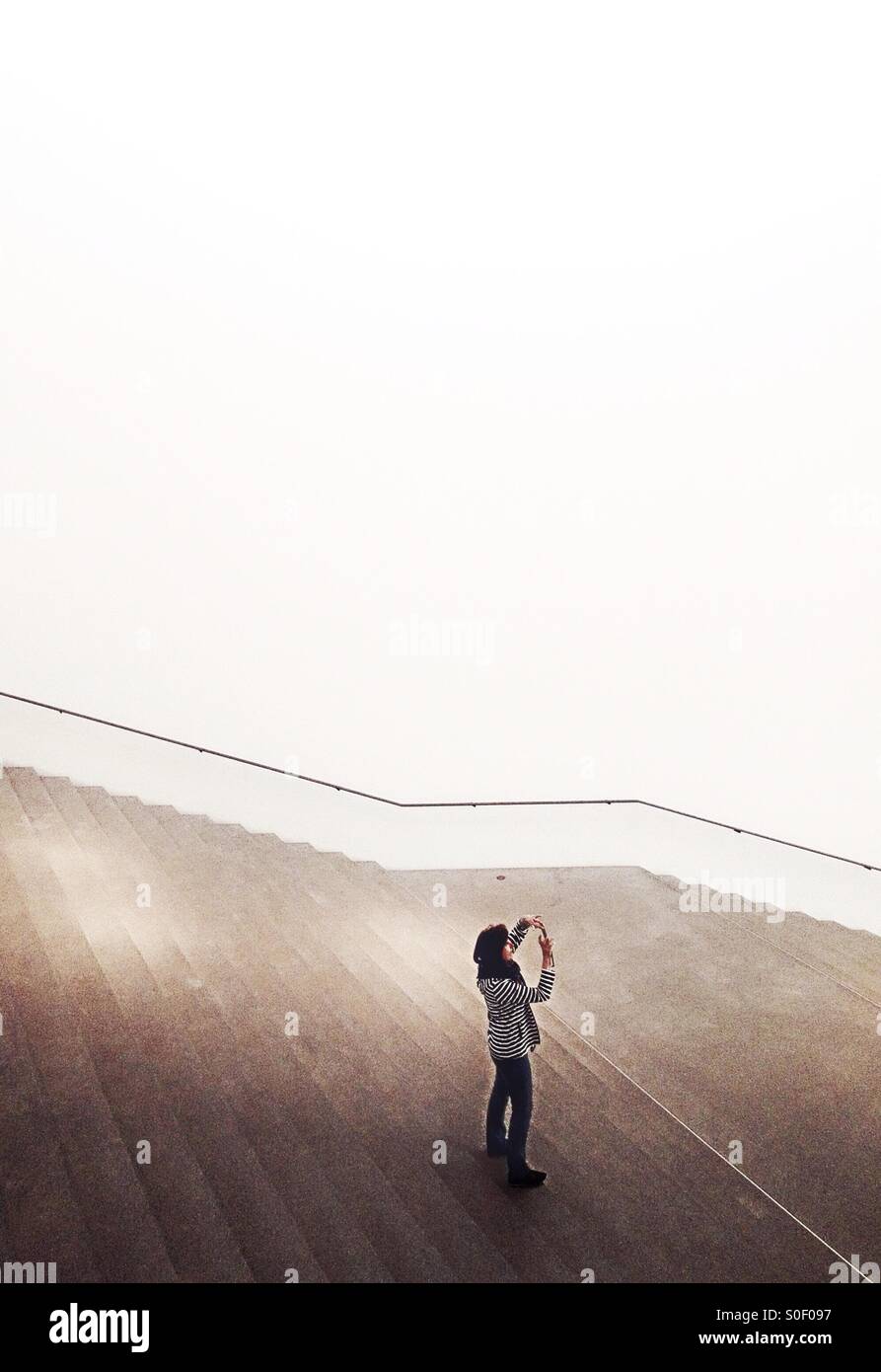 Selfie - taking a mobile photo - Smartphone Captured Stock Image