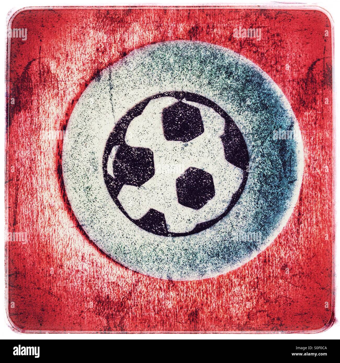 A tongue tattoo of a football printed on edible paper for children - Smartphone Captured Stock Image