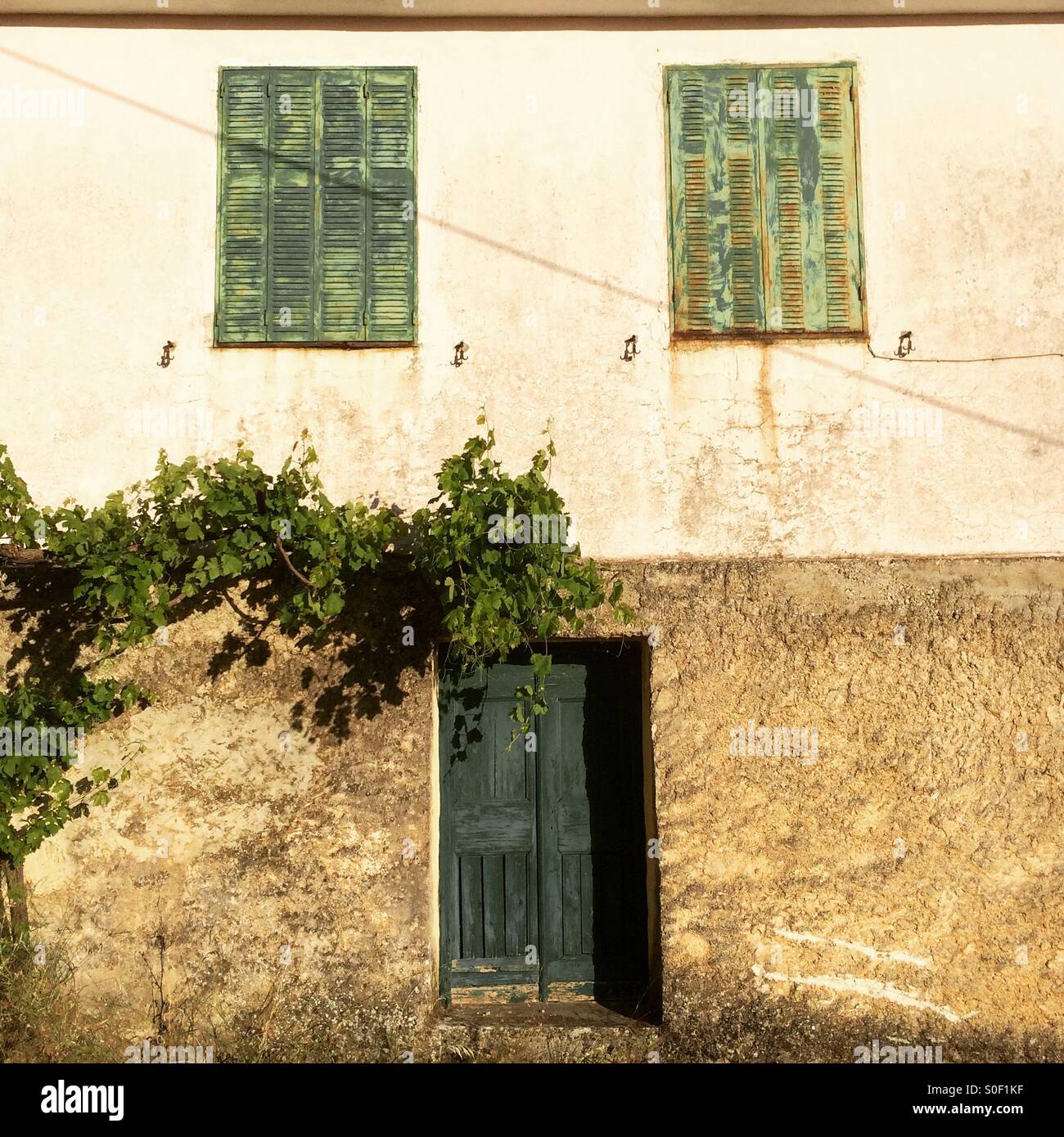 A house in Kefalonia, Greece, that looks like a face. - Smartphone Captured Stock Image