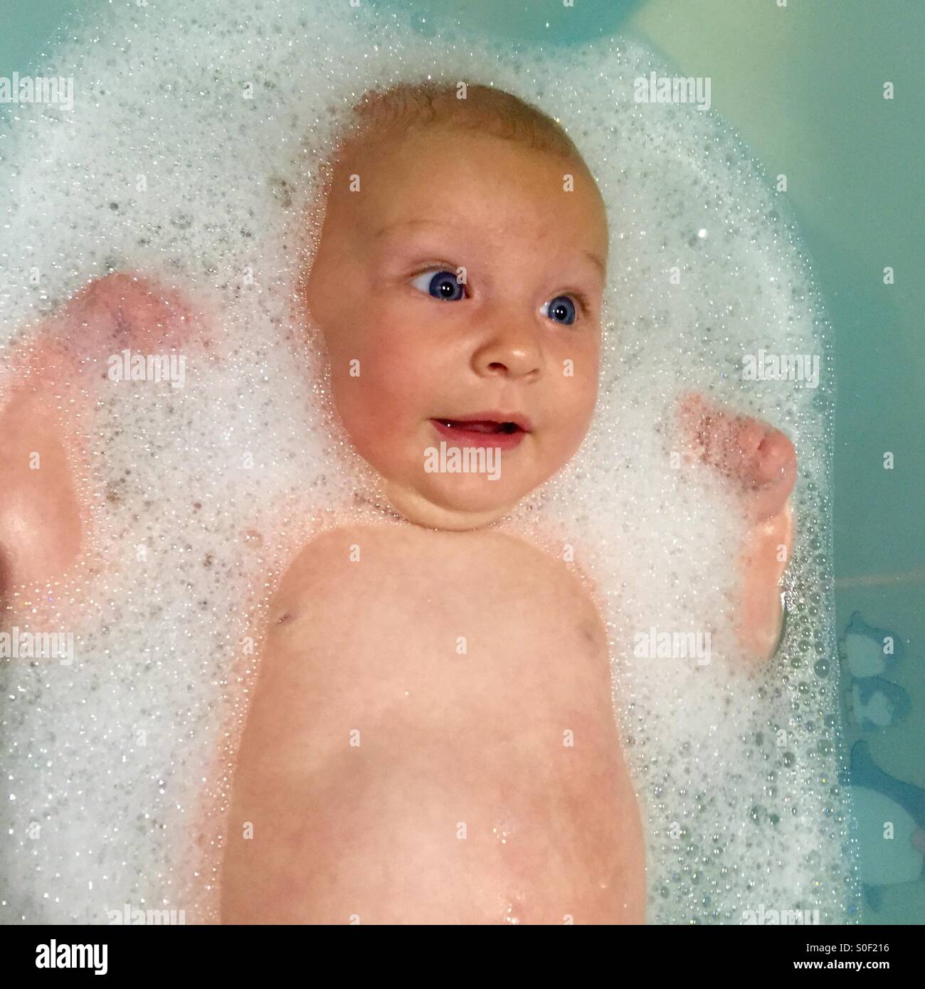 Newborn in bath hires stock photography and images Alamy