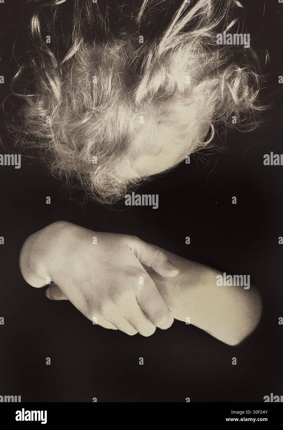 Girl with folded hands hi-res stock photography and images - Alamy