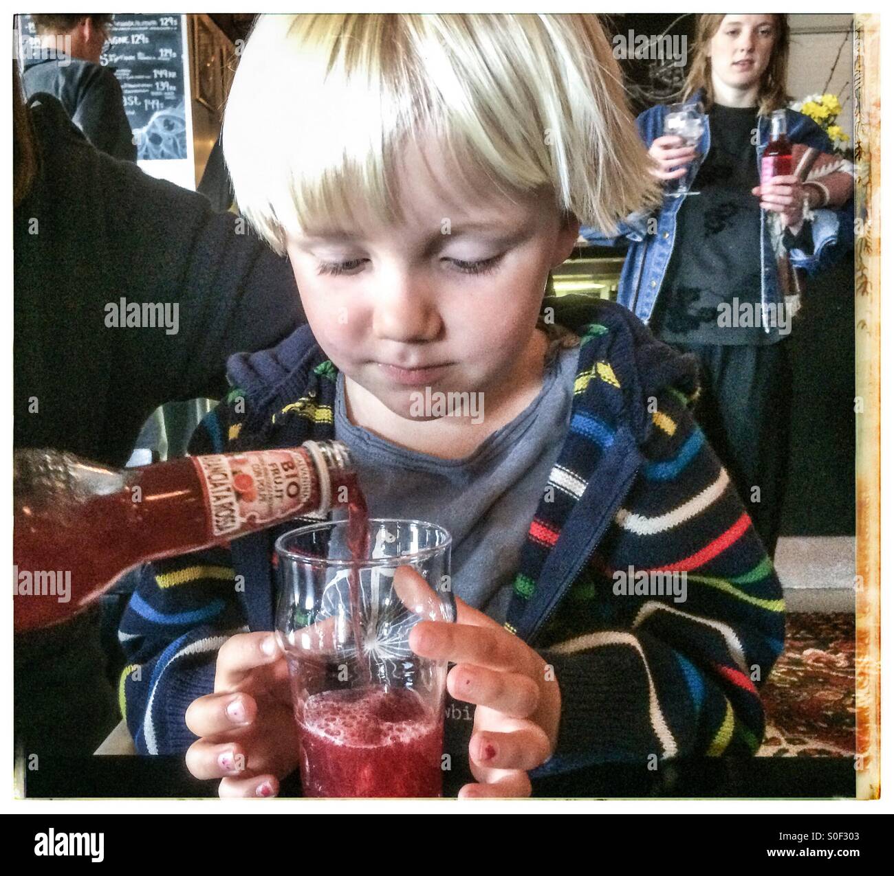 young boy excited about tasting soft drink Stock Photo Alamy