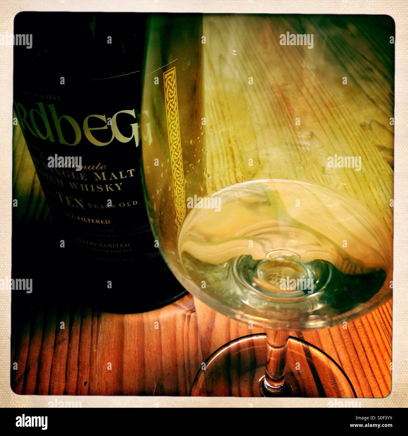 Nosing Glass and Whisky Bottle - Smartphone Captured Stock Image