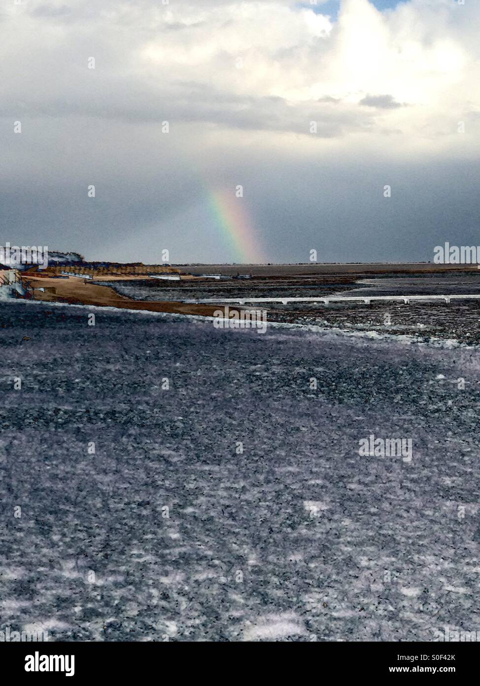 A rainbow appears after the storm Stock Photo - Alamy