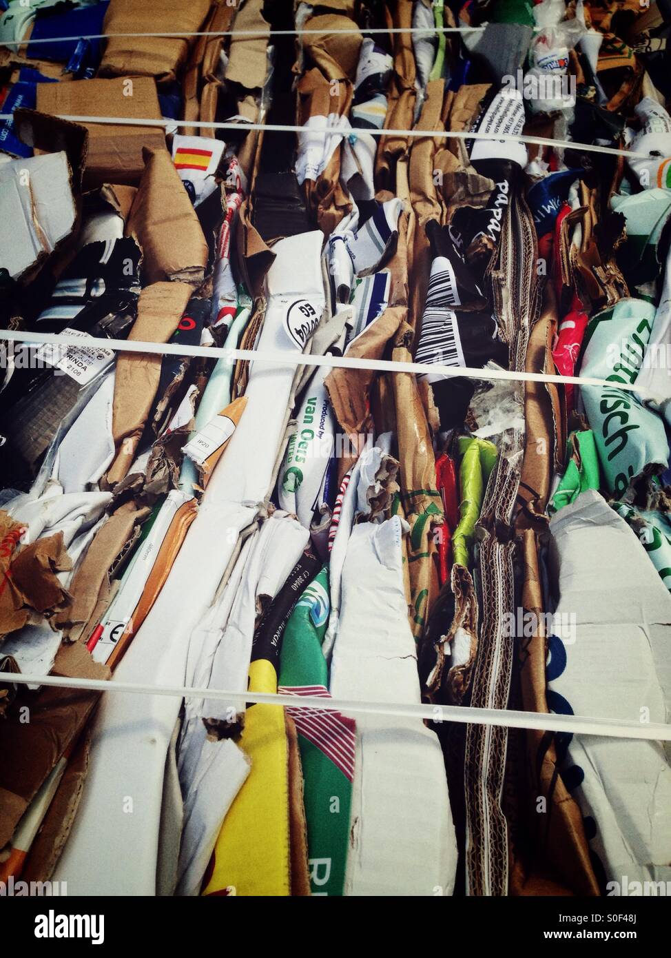 Cardboard and Paper tied to Bales in Order to recycle - Smartphone Captured Stock Image
