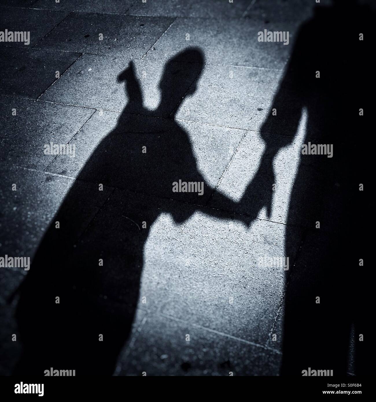 Shadow of a family walking on street - Smartphone Captured Stock Image