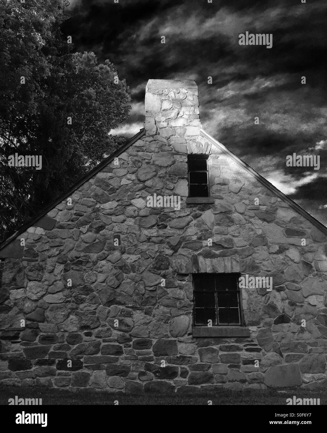 Ancient, abandoned stone cottage. Stock Photo