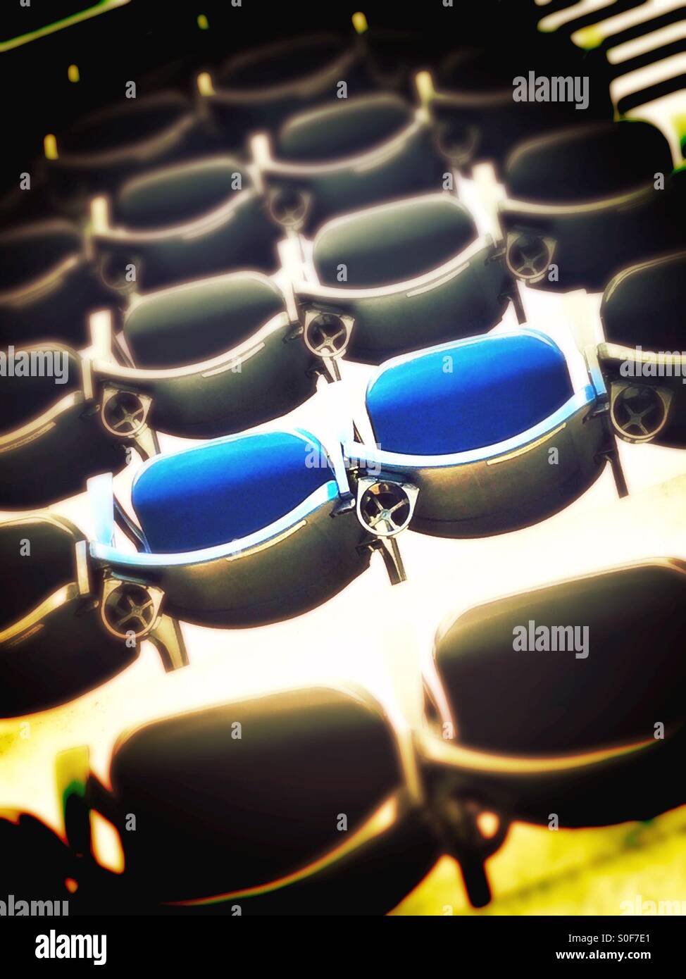 Two seats in color in a stadium of black and white - Smartphone Captured Stock Image