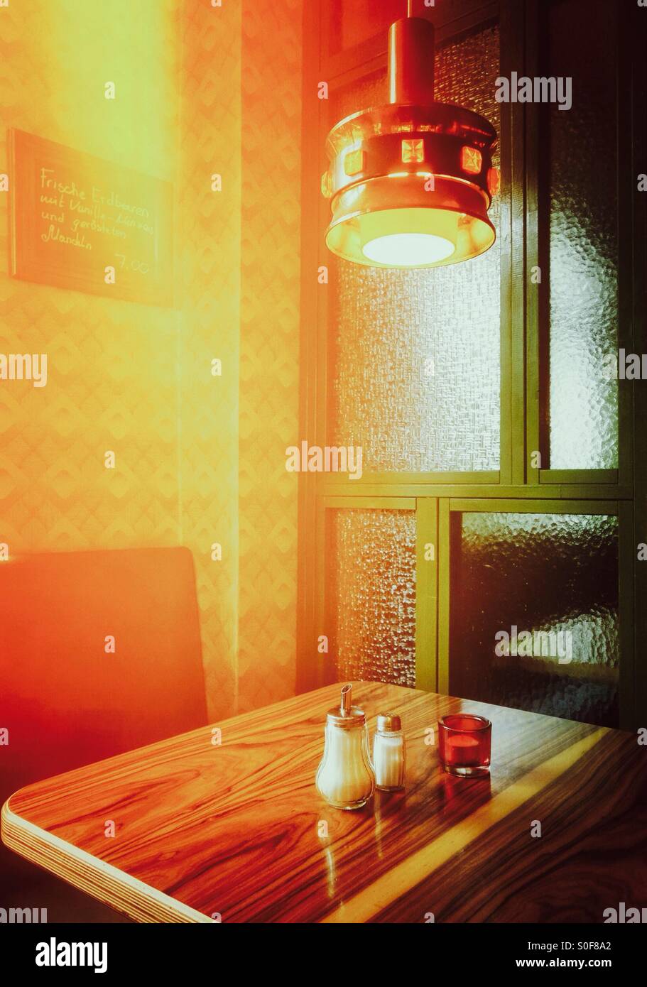 A Berlin retro cafe bar interior - Datscha Friedrichshain Berlin Germany EU - cafe table - Smartphone Captured Stock Image