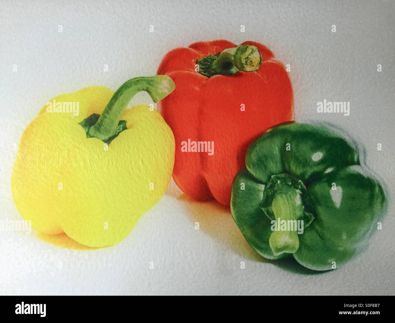 Coloured Peppers behind frosted glass Stock Photo