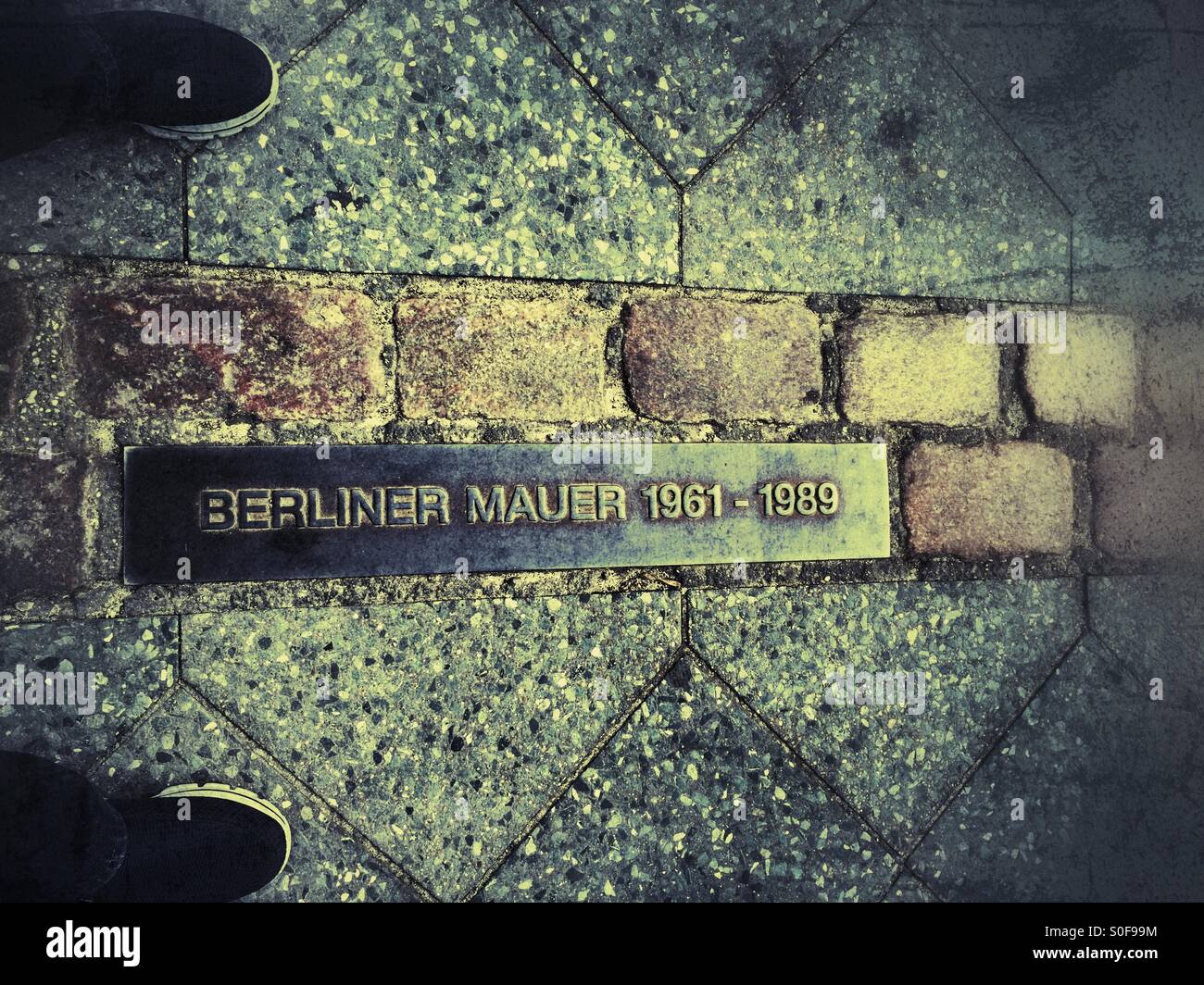 Man standing at Berlin Wall land mark - Smartphone Captured Stock Image