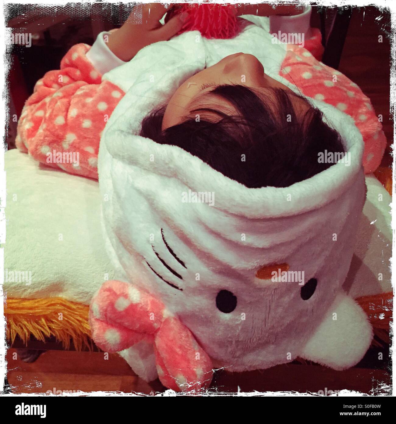 Girl in onesie sleeping Stock Photo Alamy
