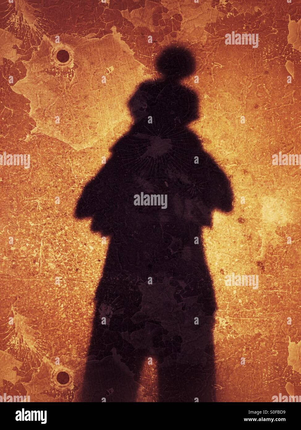 Shadow of father carrying his son - Smartphone Captured Stock Image