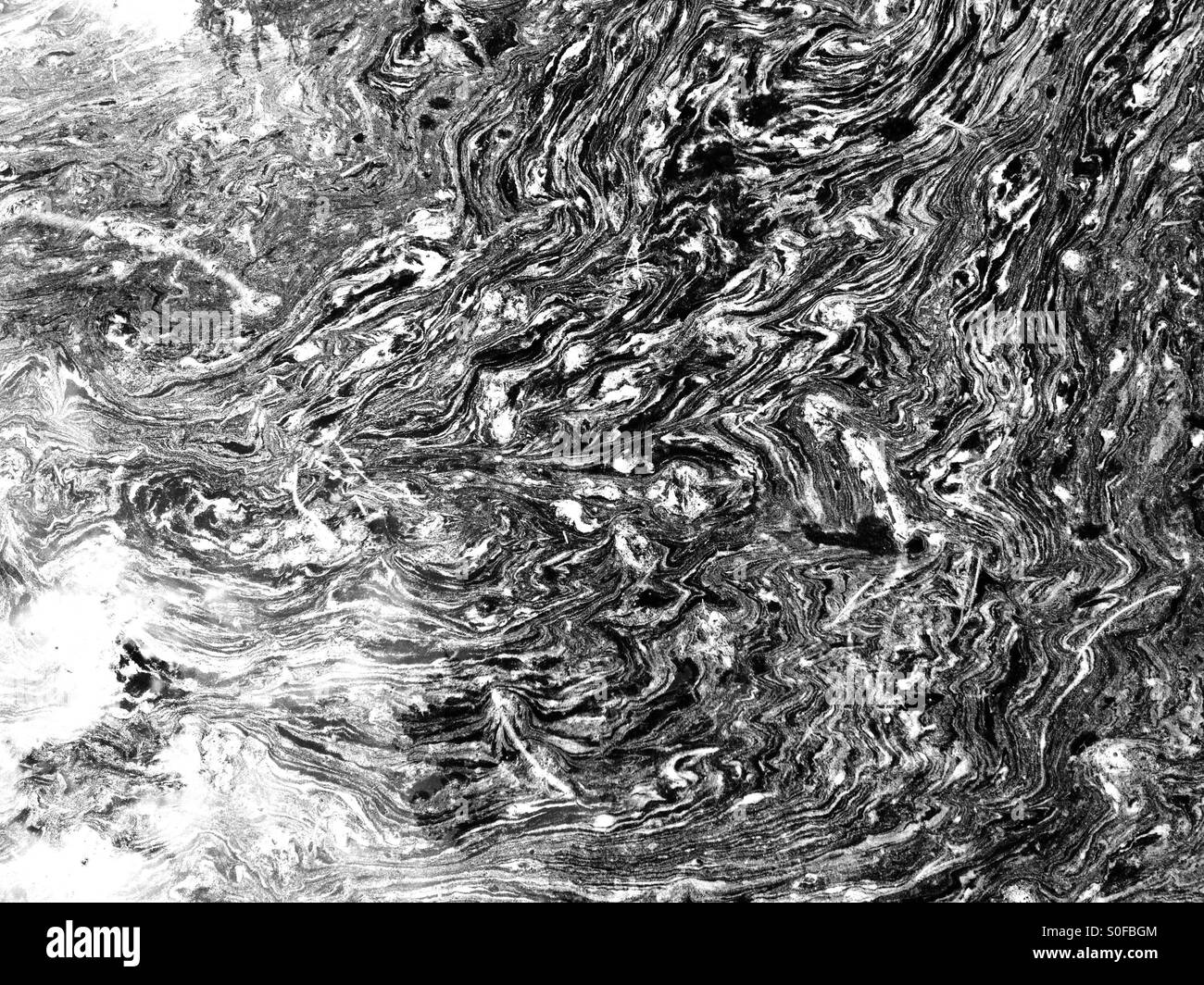 Oil in puddle of water Stock Photo - Alamy