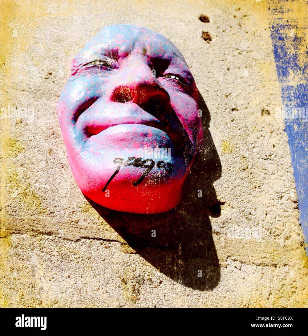 Face sculpture by French street artist Gregos. Spitalfields, London, UK. - Smartphone Captured Stock Image