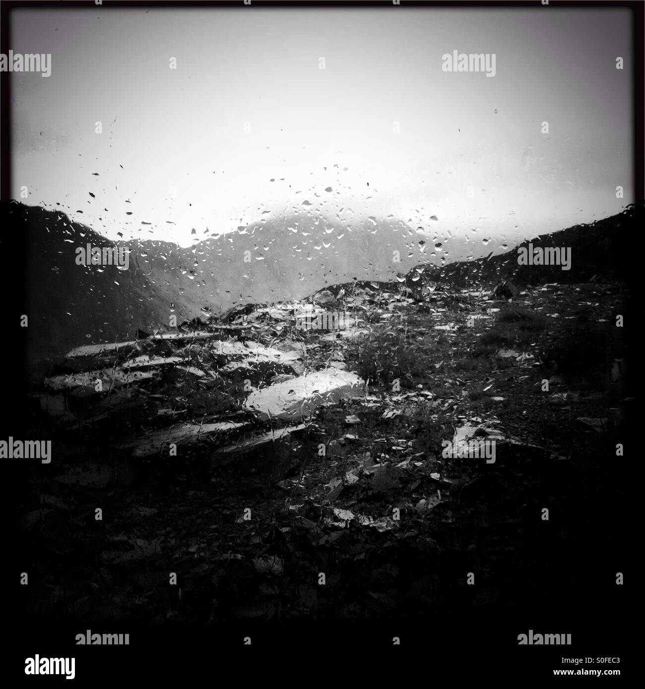 Misty mountain through a rainy window - Smartphone Captured Stock Image