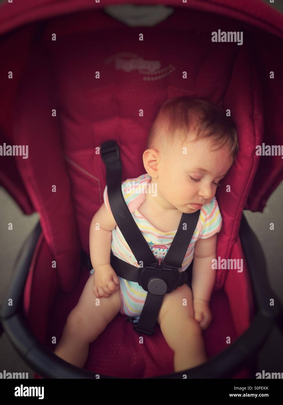 Baby sleeping in stroller Stock Photo Alamy