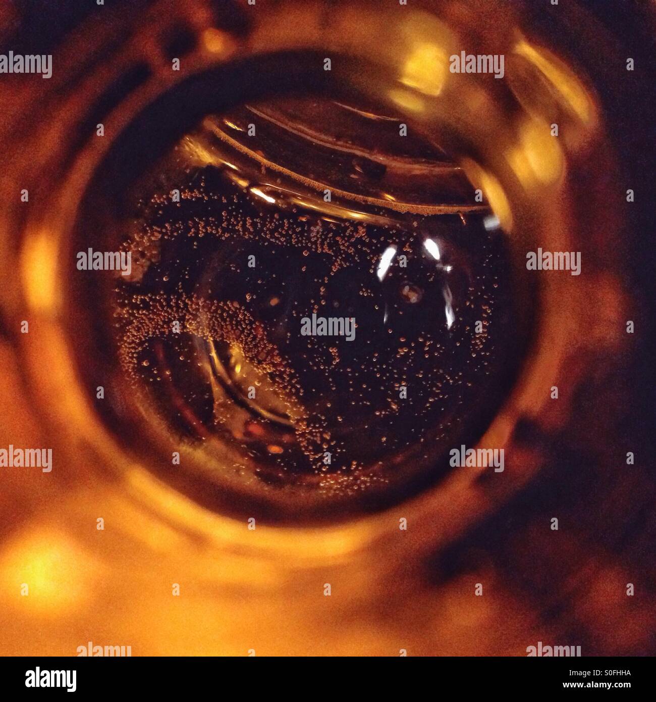 Top view into a beer bottle, abstract concept for drinking and alcoholism - Smartphone Captured Stock Image Top view into a beer bottle, abstract concept for drinking and alcoholism - Smartphone Captured Stock Image