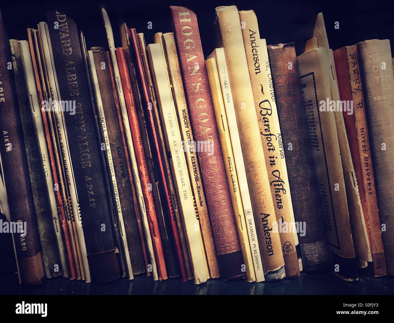 Vintage scripts on bookshelf - Smartphone Captured Stock Image