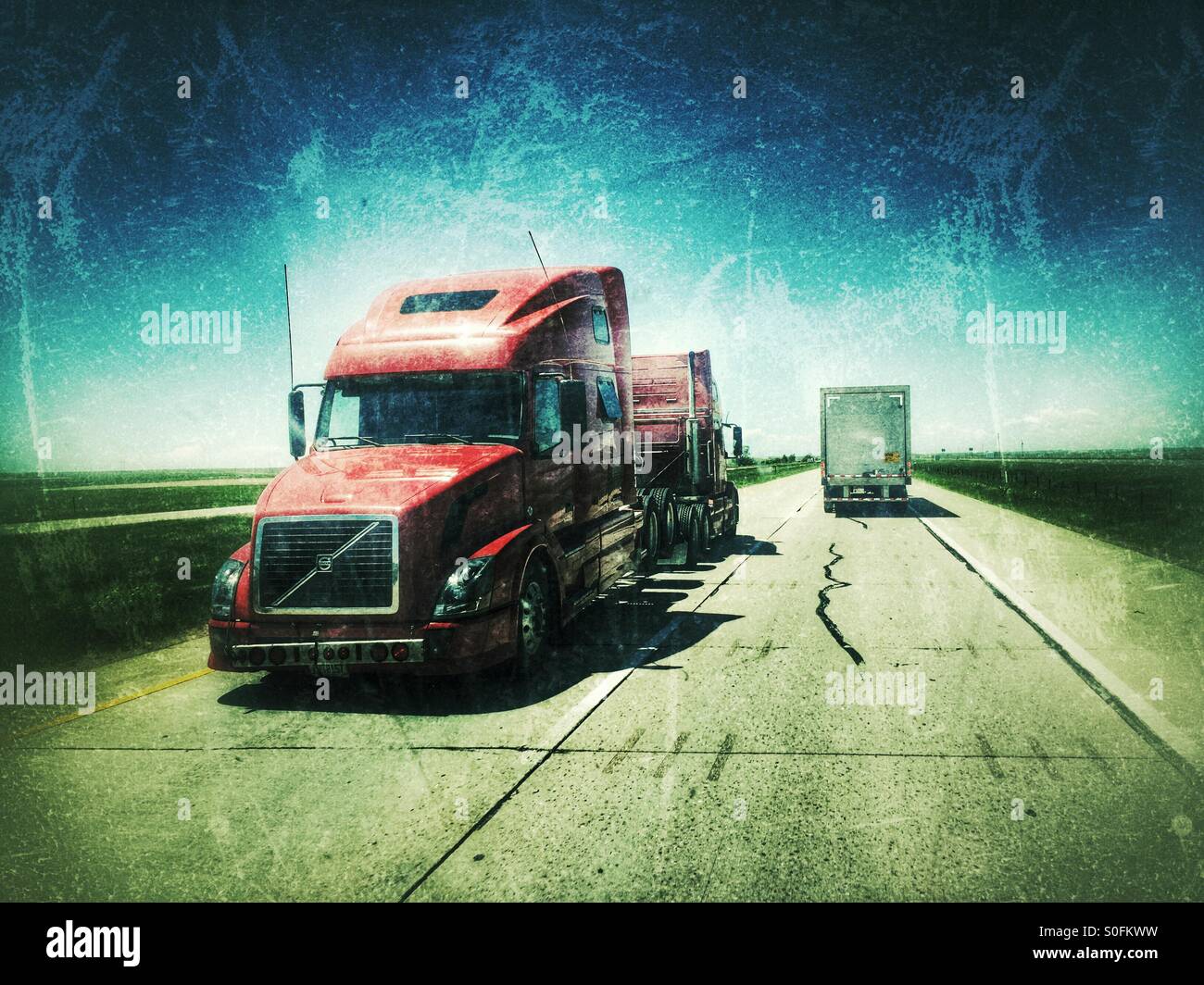 Semi tractor tow truck towing semi rig Stock Photo