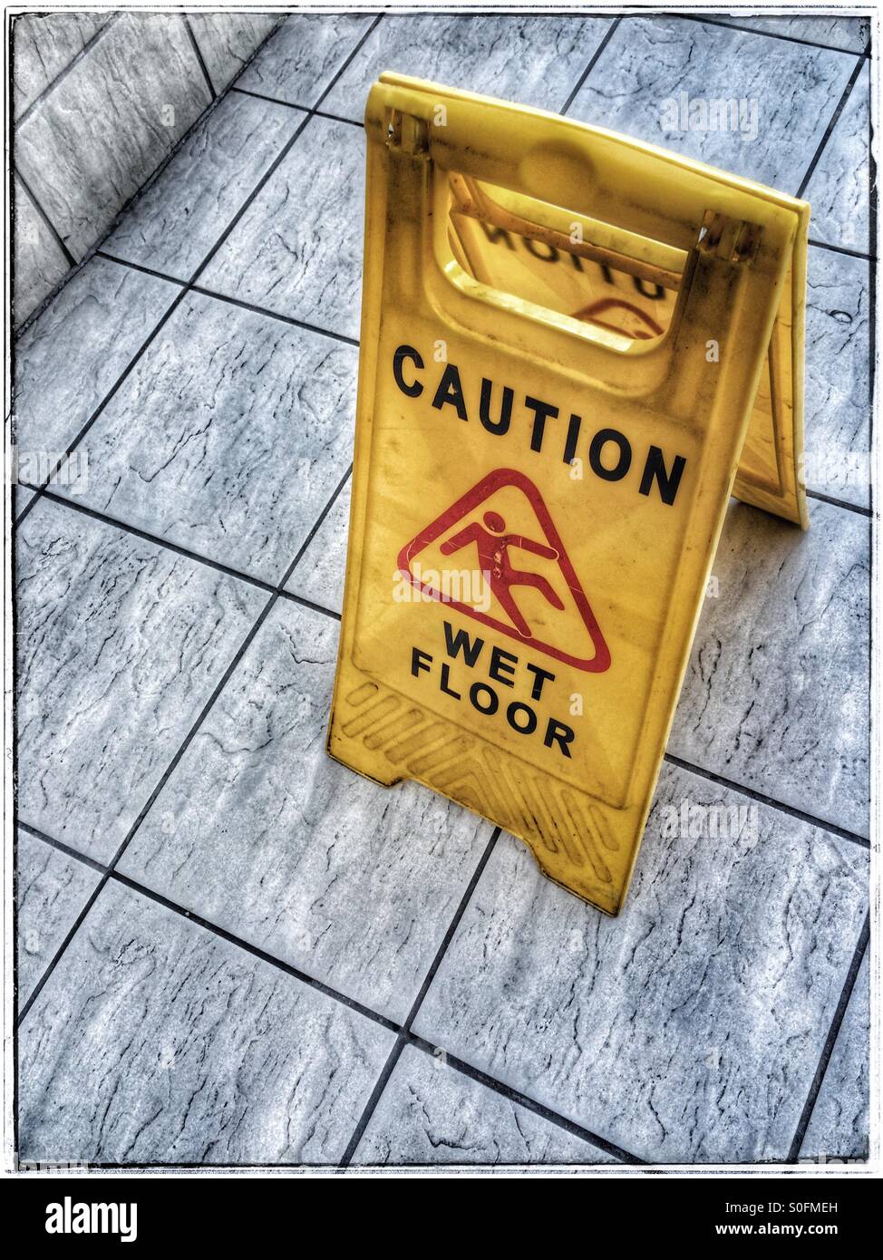 Caution wet floor sign. - Smartphone Captured Stock Image