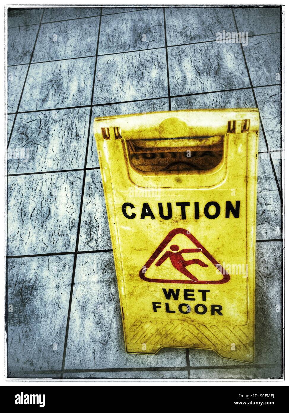 Caution wet floor sign. - Smartphone Captured Stock Image