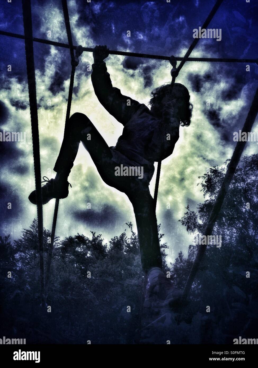 Girl on climbing frame Stock Photo Alamy