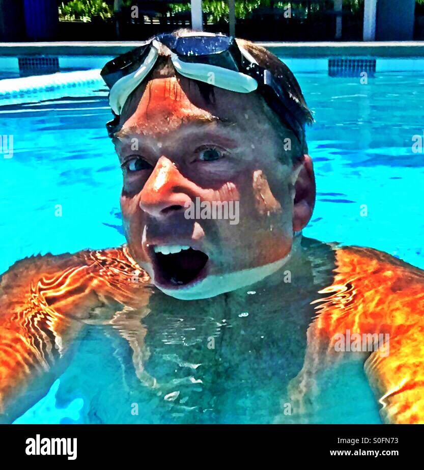 The swimmer. Coming up for air. - Smartphone Captured Stock Image