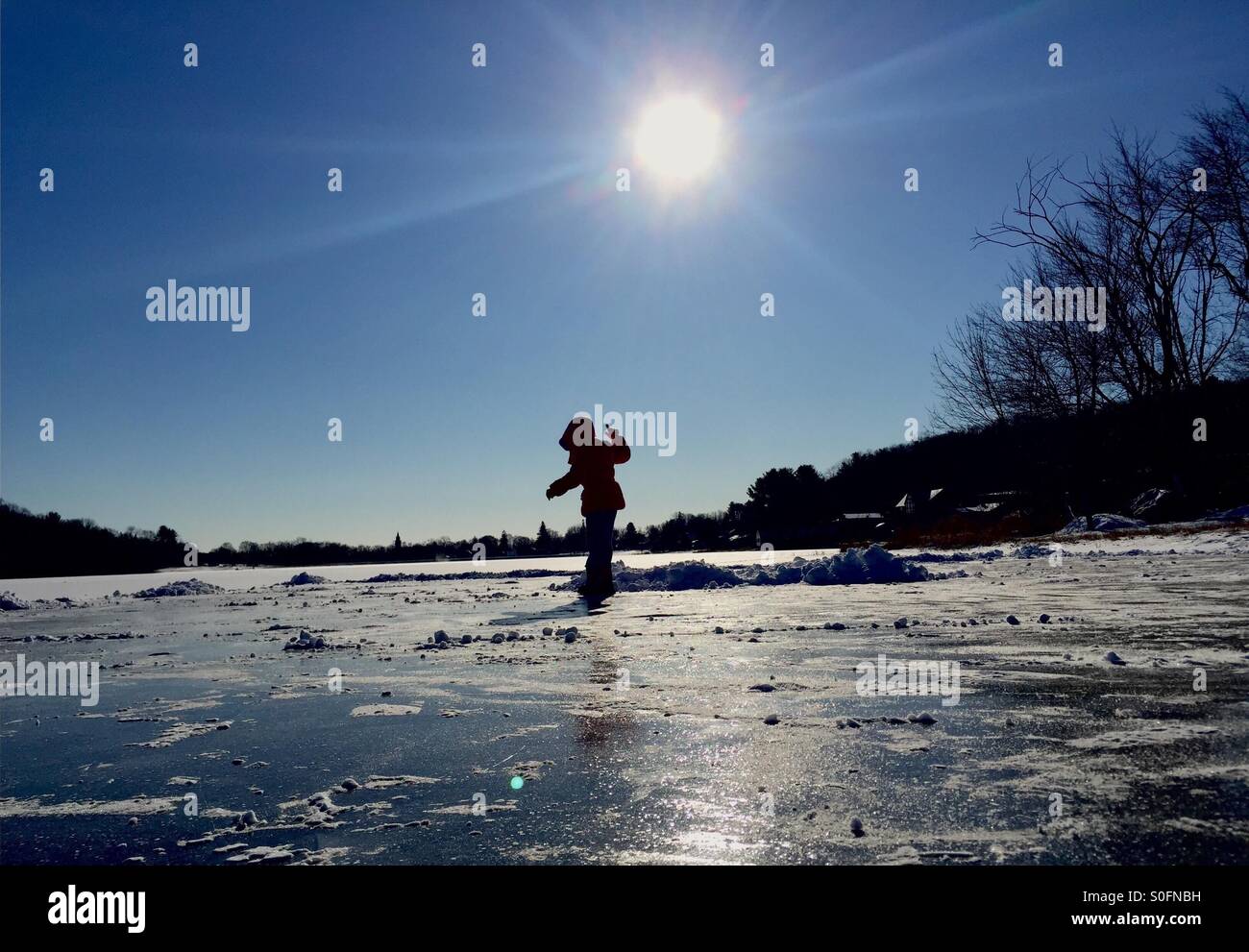 Child ice skating on Gardner Lake in Amesbury, MA Stock Photo Alamy