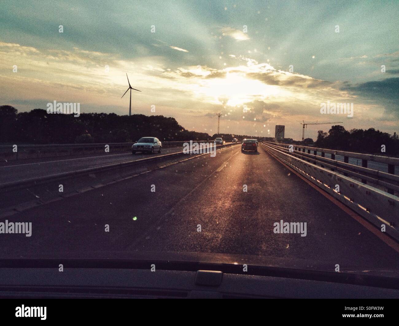 Driving into Sunset on the Highway - Smartphone Captured Stock Image