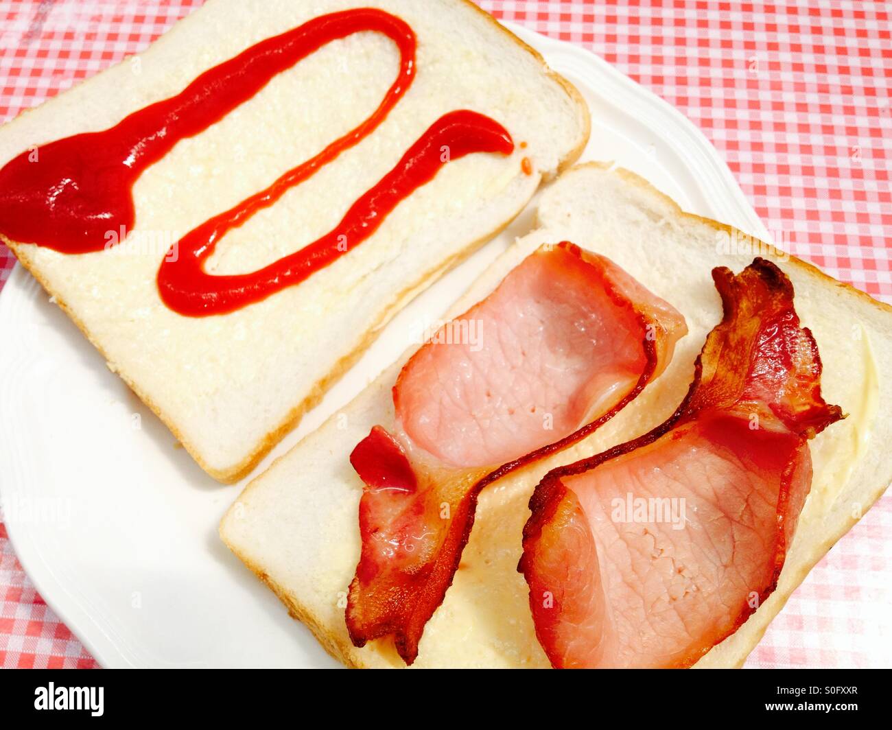 Bacon sandwich with tomato ketchup Stock Photo Alamy