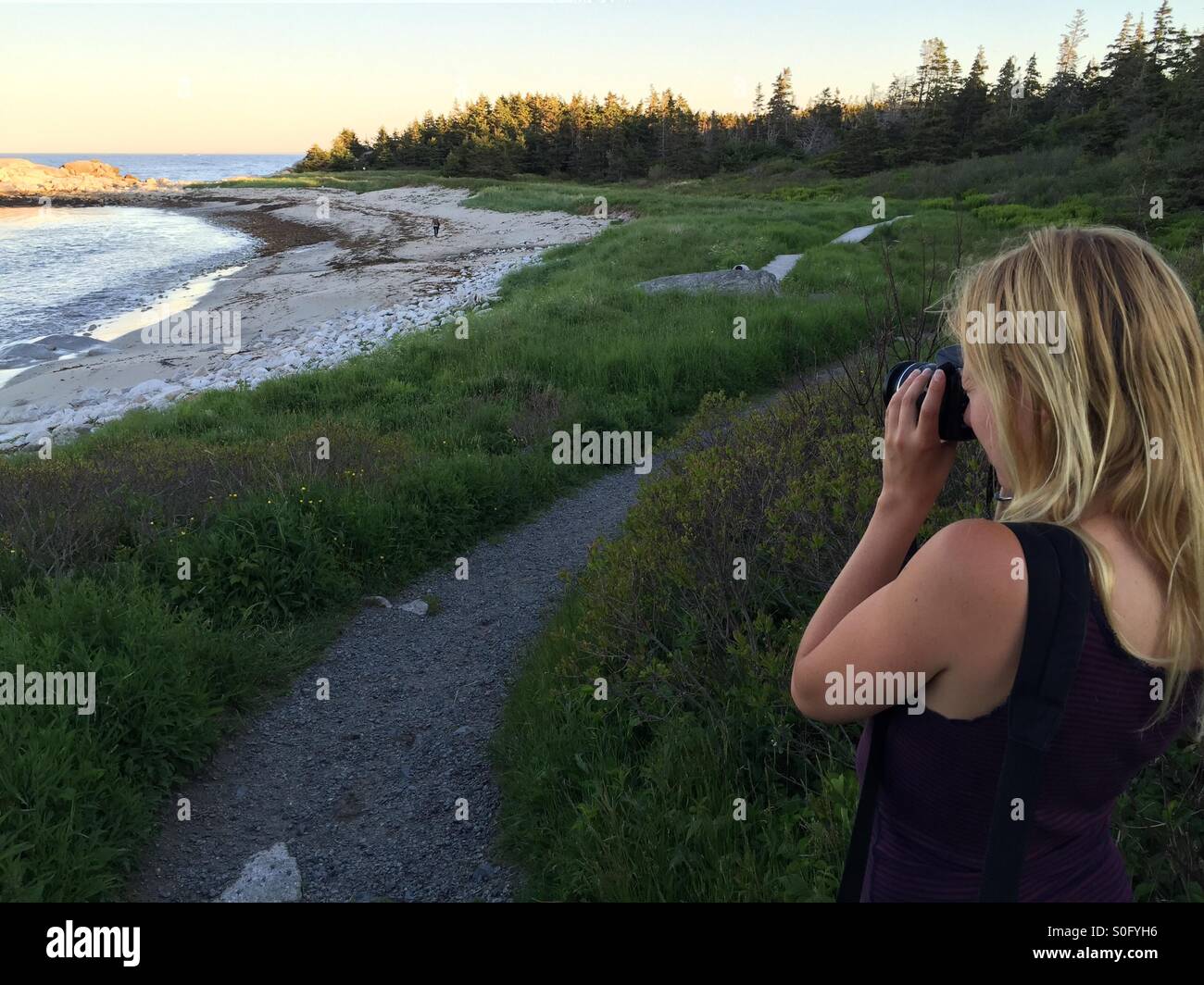 Woman sunset beach - Smartphone Captured Stock Image