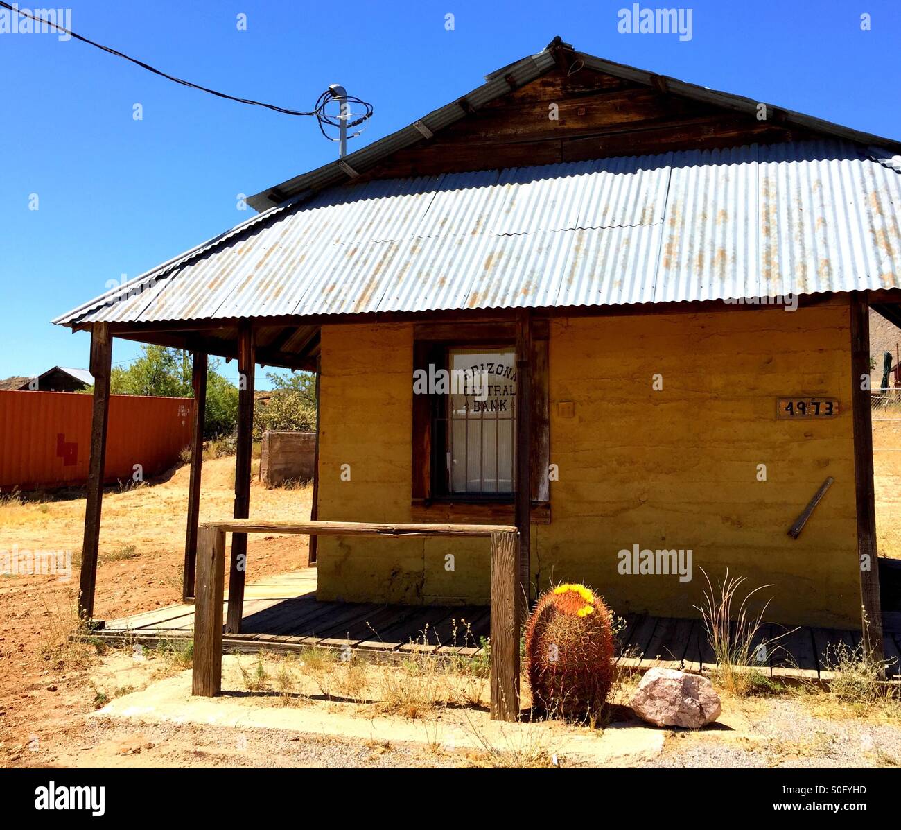Ghost town bank with cactus - Smartphone Captured Stock Image