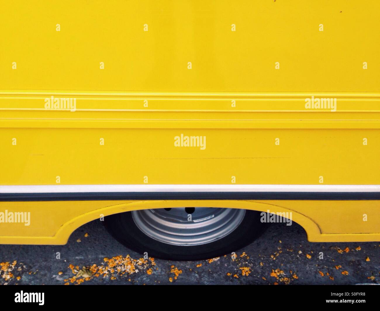 Wheel of a yellow truck Stock Photo
