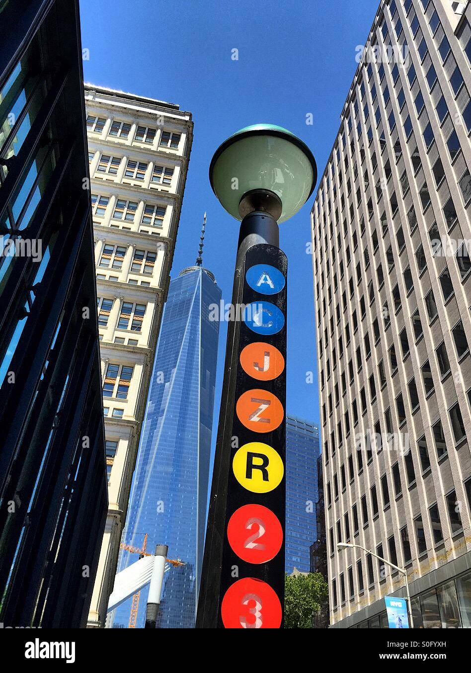 Subway line signpost with Freedom Tower in background, lower Manhattan, NYC - Smartphone Captured Stock Image