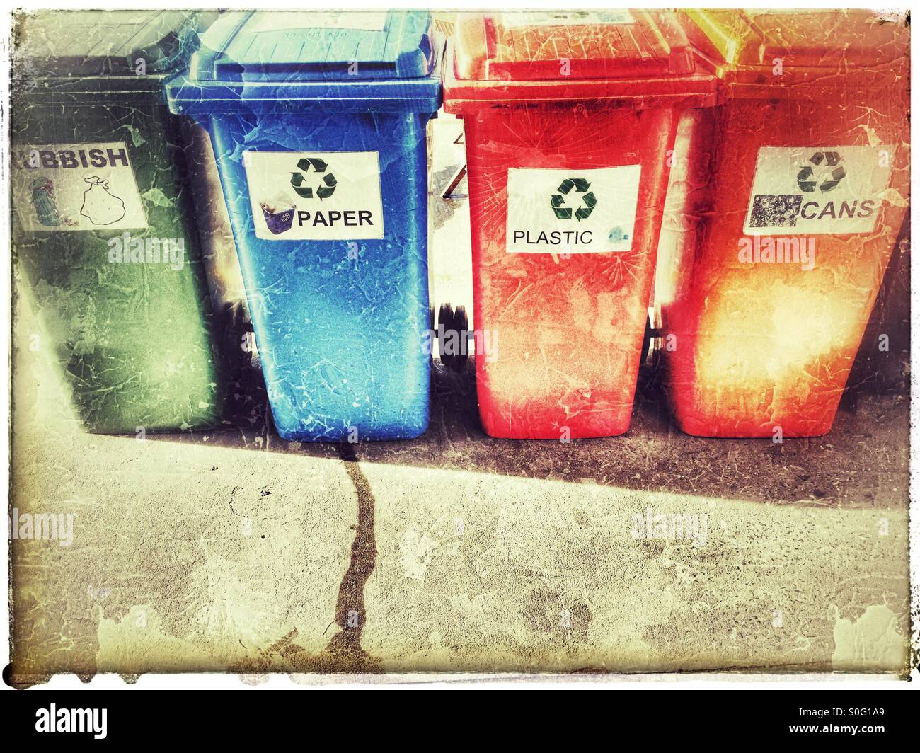 Row of colourful recycling wheelie bins Stock Photo - Alamy