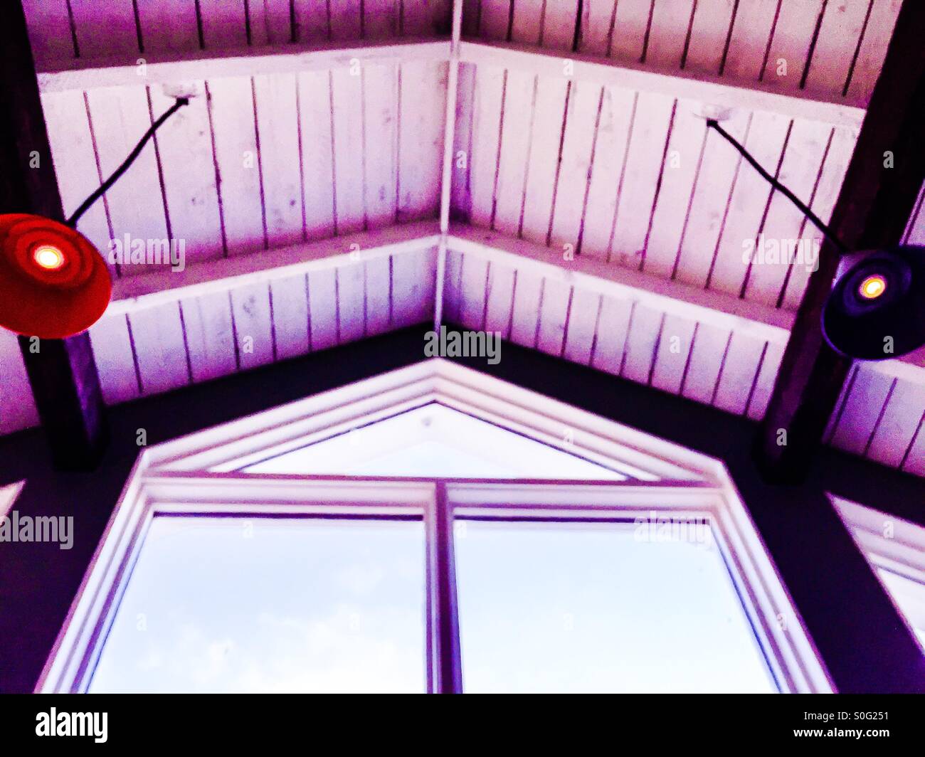 Geometry of triangles. Interior architecture detail. Looking up. Big windows. Wooden ceiling. Lights. - Smartphone Captured Stock Image