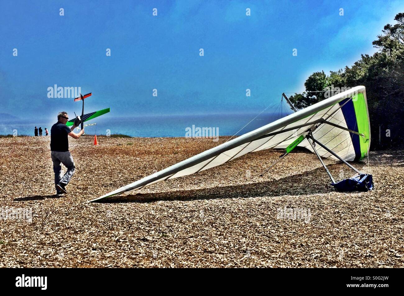 Checking out the size of the other guy's plane. - Smartphone Captured Stock Image