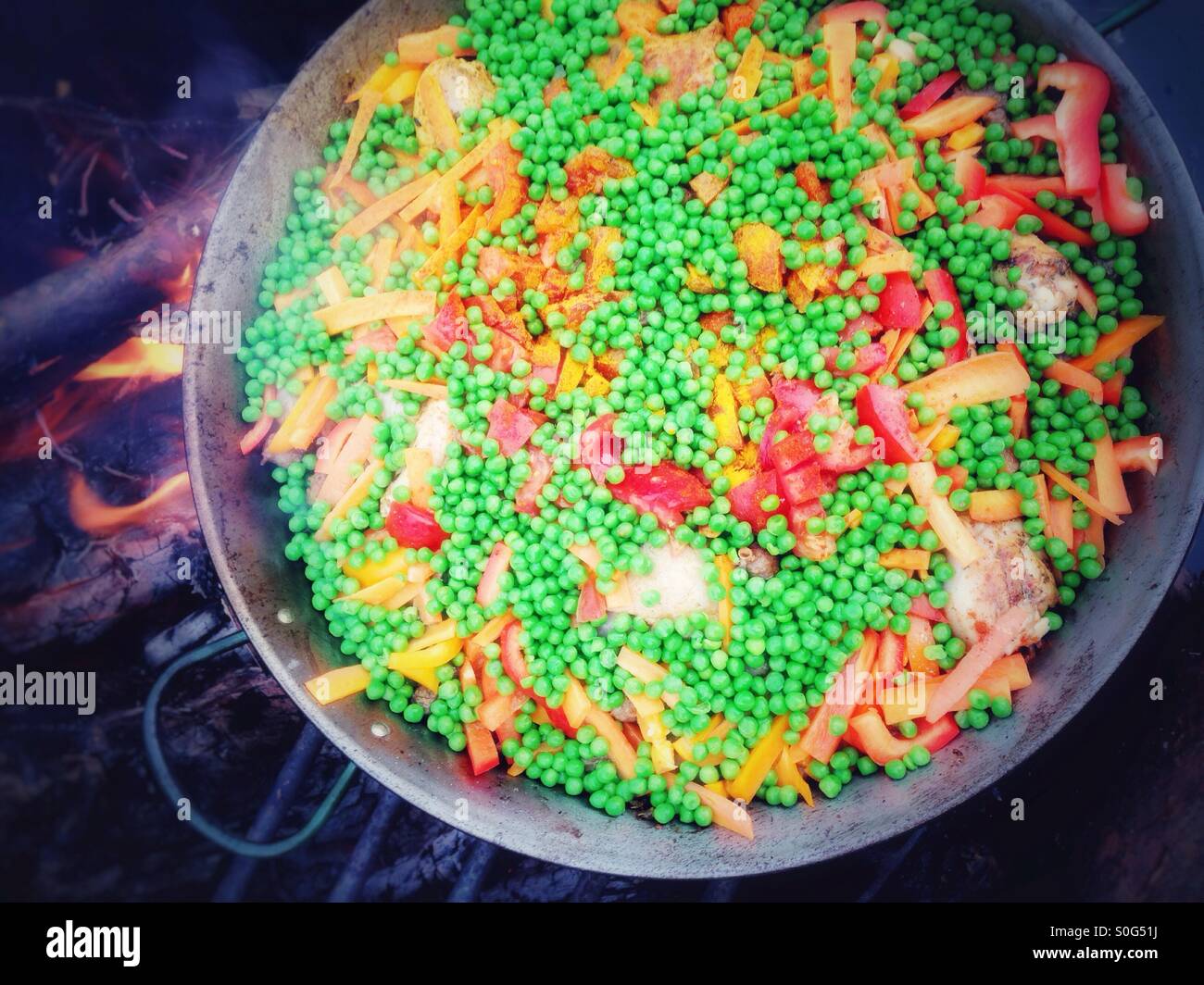 Vegetables and Meat in a Pan for a Paella Outdoors - Smartphone Captured Stock Image