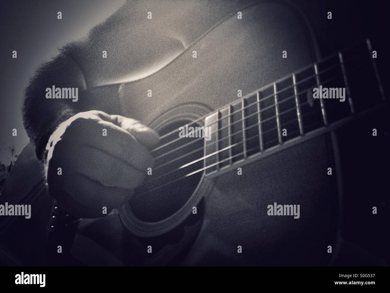Man playing an acoustic guitar - Smartphone Captured Stock Image