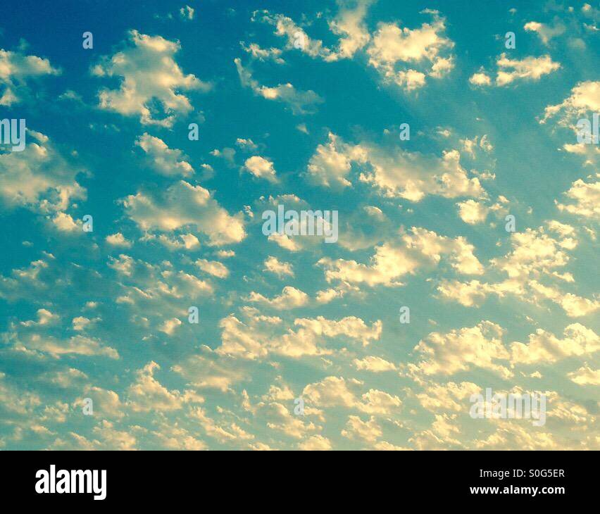 Cotton wool clouds, blue sky Stock Photo Alamy