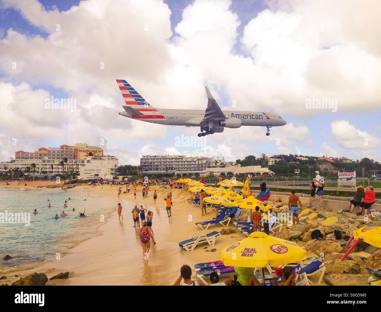 Plane coming in to land over Maho beach on Saint Maarten, Caribbean Stock Photo