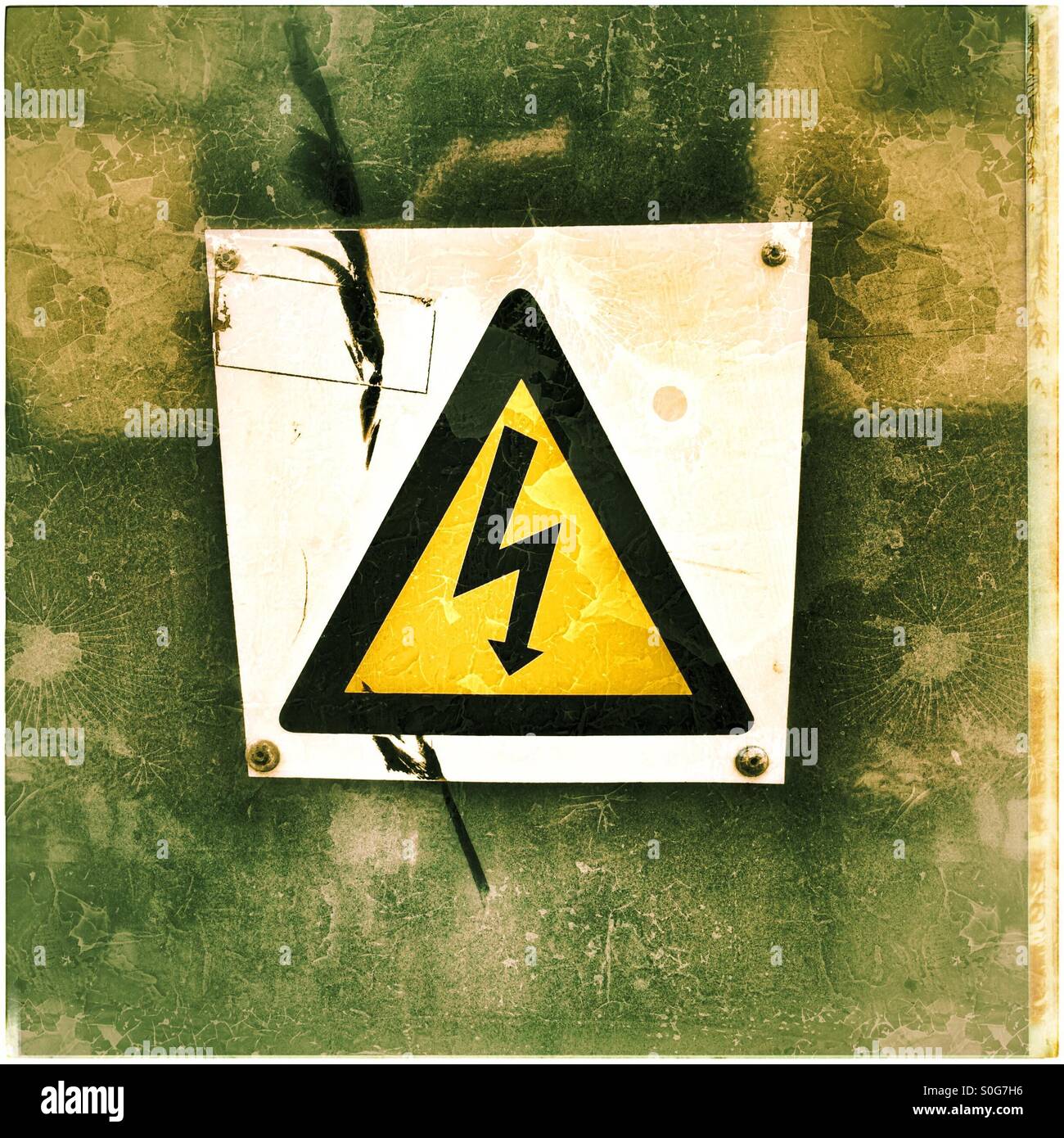 Damaged electricity sign. - Smartphone Captured Stock Image